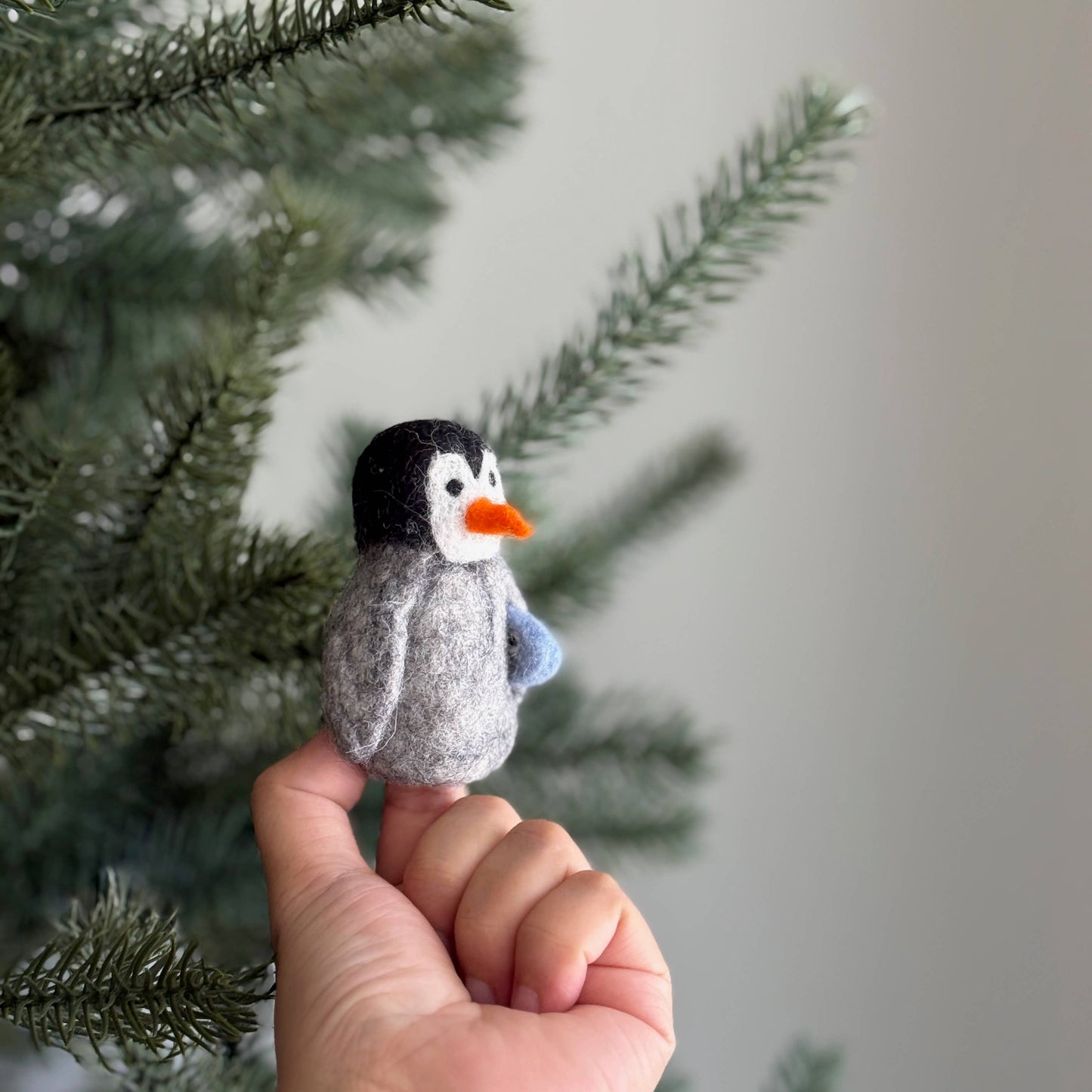 Felt Penguin Carrying A Fish Finger Puppet